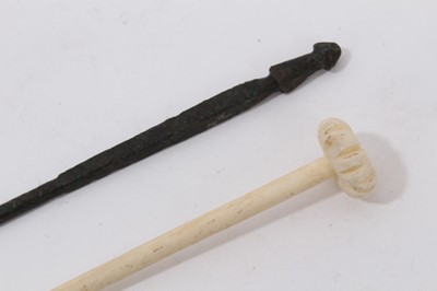 Lot 1072 - Bronze Roman pin and a Roman carved bone pin (2)