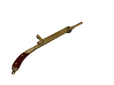 Lot 793 - Unusual brass lighter in the form of a shot gun, 20cm in overall length.