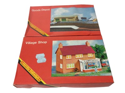 Lot 323 - Hornby OO gauge Railway Buildings including Village Station R002 & Straight Platform R460, Goods Depot R192, Village Shop R193 & Modern Engine Shed R146, all boxed (5)