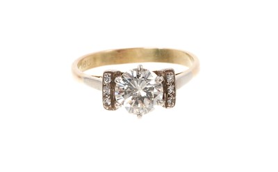 Lot 735 - Diamond single stone ring with a round brilliant cut diamond estimated to weigh approximately 1.20cts in six claw platinum setting with diamond set shoulders on 18ct gold shank.