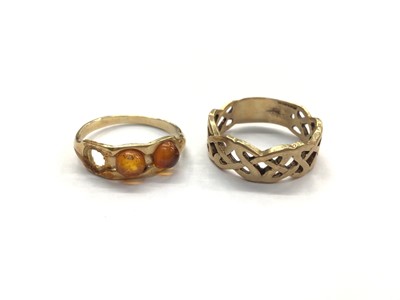 Lot 1010 - Polish gold ring set with amber cabochons and a 9ct gold Celtic knot ring