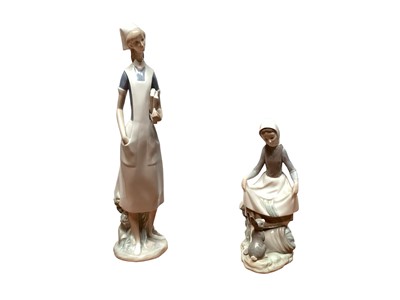 Lot 1138 - Collection of five Lladro figures together with a NAO dog (6)
