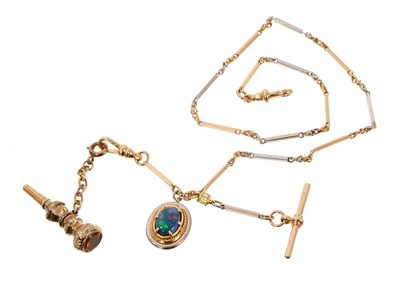 Lot 734 - 18ct yellow gold and platinum watch chain with a black opal pendant and winding key fob