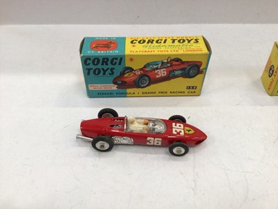 Lot 1810 - Corgi Aston Martin DB4 No. 218, Fiat No. 232, E Type Jaguar with detachable hard top No. 307, Lotus Racing Car No. 241. Ferrari Formula 1 No. 154 all boxed (5)