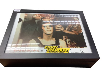 Lot 141 - David Bowie in Ziggy Stardust and the Spiders from Mars, collection of lobby cards including three framed, with certificate of authenticity