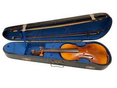 Lot 2235 - Early 20th century continental violin with two bows, cased