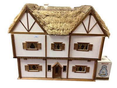 Lot 1760 - Scratch built dolls house with thatched roof, commissioned by a lady to resemble her cottage, fitted with electric lights, together with a large selection of furniture