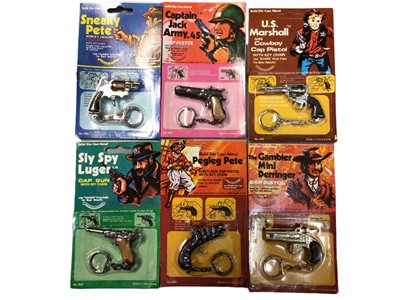 Lot 363 - Selection of miniature pistol key rings, six in original packaging (Approx.34)