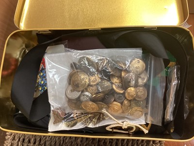 Lot 677 - Tin of military badges, buttons, Royal Navy cap tallies, military cards in sets