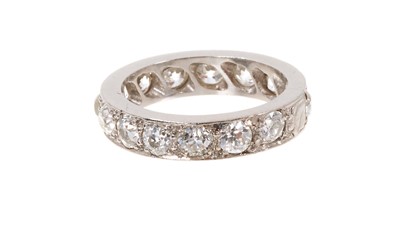 Lot 748 - Diamond eternity ring with a full band eternity ring with old cut diamonds