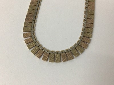 Lot 16 - 9ct three-colour gold Cleopatra style fringe necklace