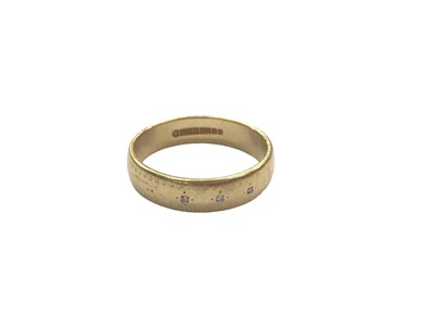 Lot 1040 - 18ct gold diamond set wedding ring