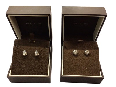 Lot 1041 - Pair 18ct white gold diamond stud tear drop earrings and pair 18ct white gold synthetic stone circular stud earrings, both boxed