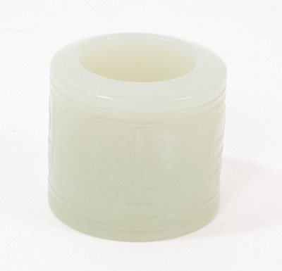 Lot 1046 - Chinese celadon jade archer's ring, relief carved with character marks
