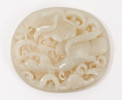 Lot 1043 - Chinese pale celadon jade plaque, carved and pierced with birds and foliate patterns