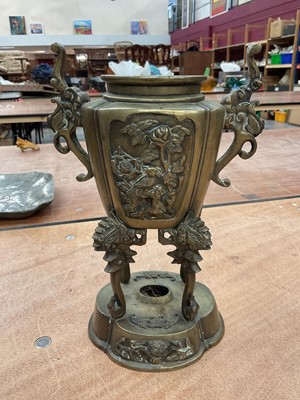 Lot 457 - Japanese bronze two handled vase, decorated in relief with flowers and birds, 25cm high