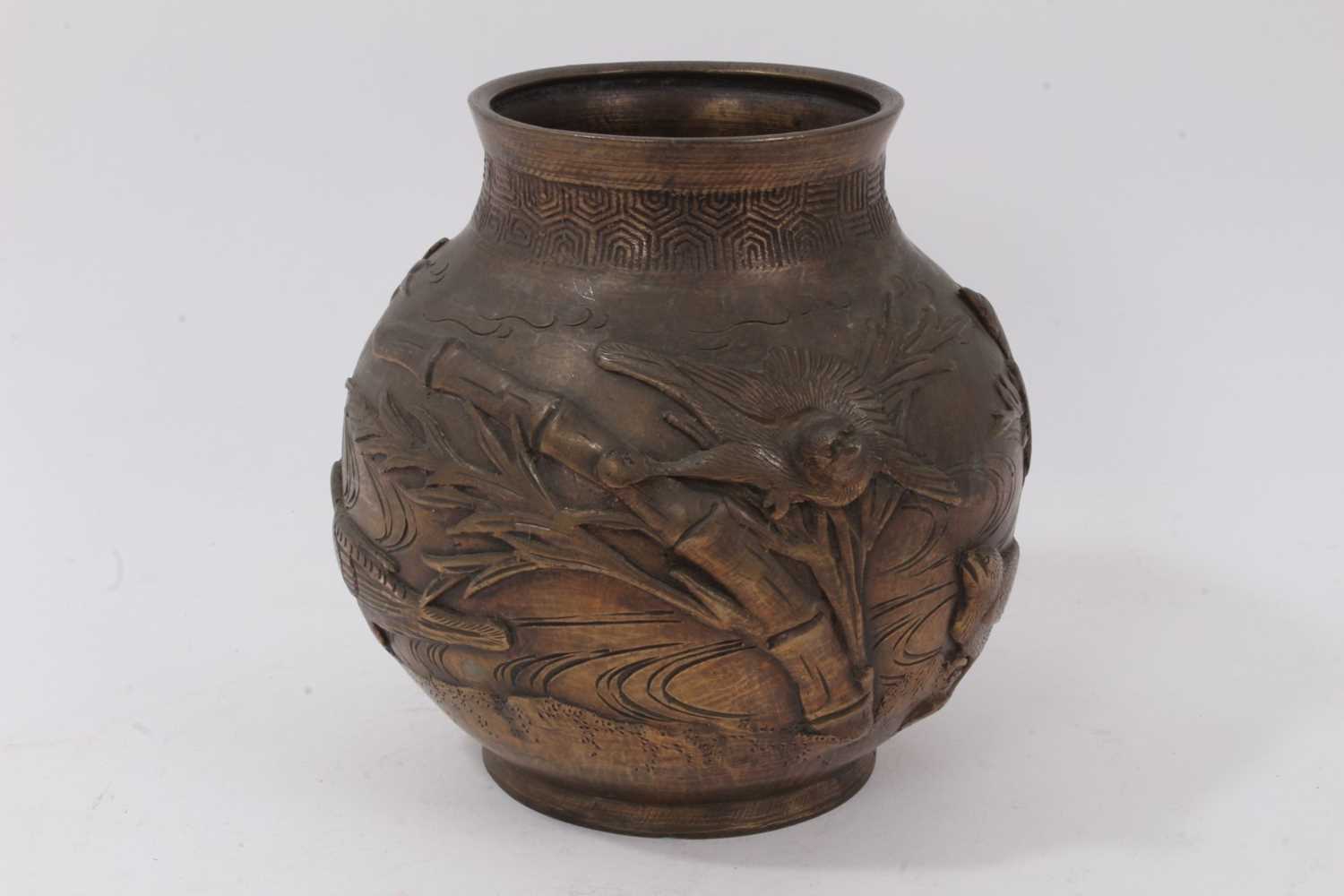 Lot 225 - Japanese bronze footed vase, decorated with birds and bamboo in relief, character marks to base, 18cm high