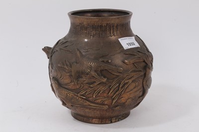 Lot 225 - Japanese bronze footed vase, decorated with birds and bamboo in relief, character marks to base, 18cm high