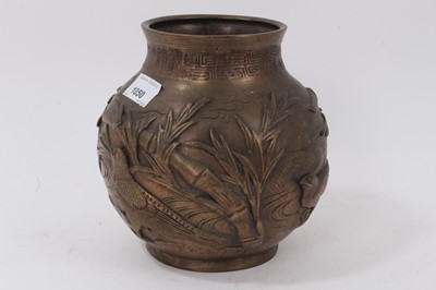 Lot 225 - Japanese bronze footed vase, decorated with birds and bamboo in relief, character marks to base, 18cm high