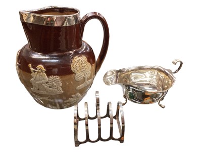 Lot 1096 - Edwardian Royal Doulton harvest jug with silver rim, together with a silver toast rack and silver sauce boat