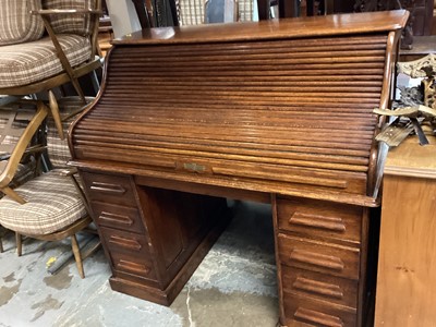 Lot 1260 - Early 20th century oak roll top desk