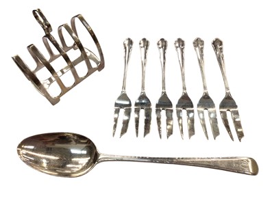 Lot 1044 - Silver toast rack, six silver cake forks and a Georgian silver tablespoon