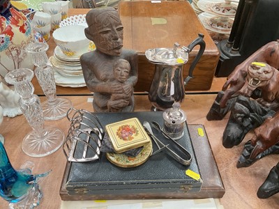 Lot 484 - Group of silver plated ware, together with compacts, prints and an African carved wood fertility figure.