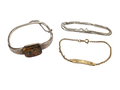 Lot 1045 - Silver and amber bangle, silver chain and a 9ct gold identity bracelet