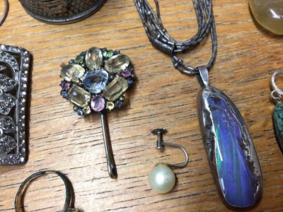 Lot 58 - Group of silver and white metal jewellery including a multi gem set pendant, paste set buckle brooch, Chinese napkin ring and some loose stones