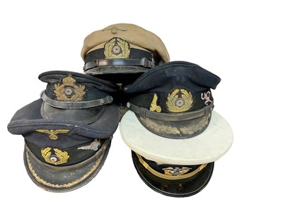 Lot 739 - Collection of four replica Nazi German military caps, together with an American Navy cap (5)