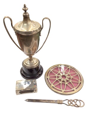 Lot 1070 - Silver two handled trophy, together with a silver letter opener, silver match box holder and a silver mounted glass teapot stand