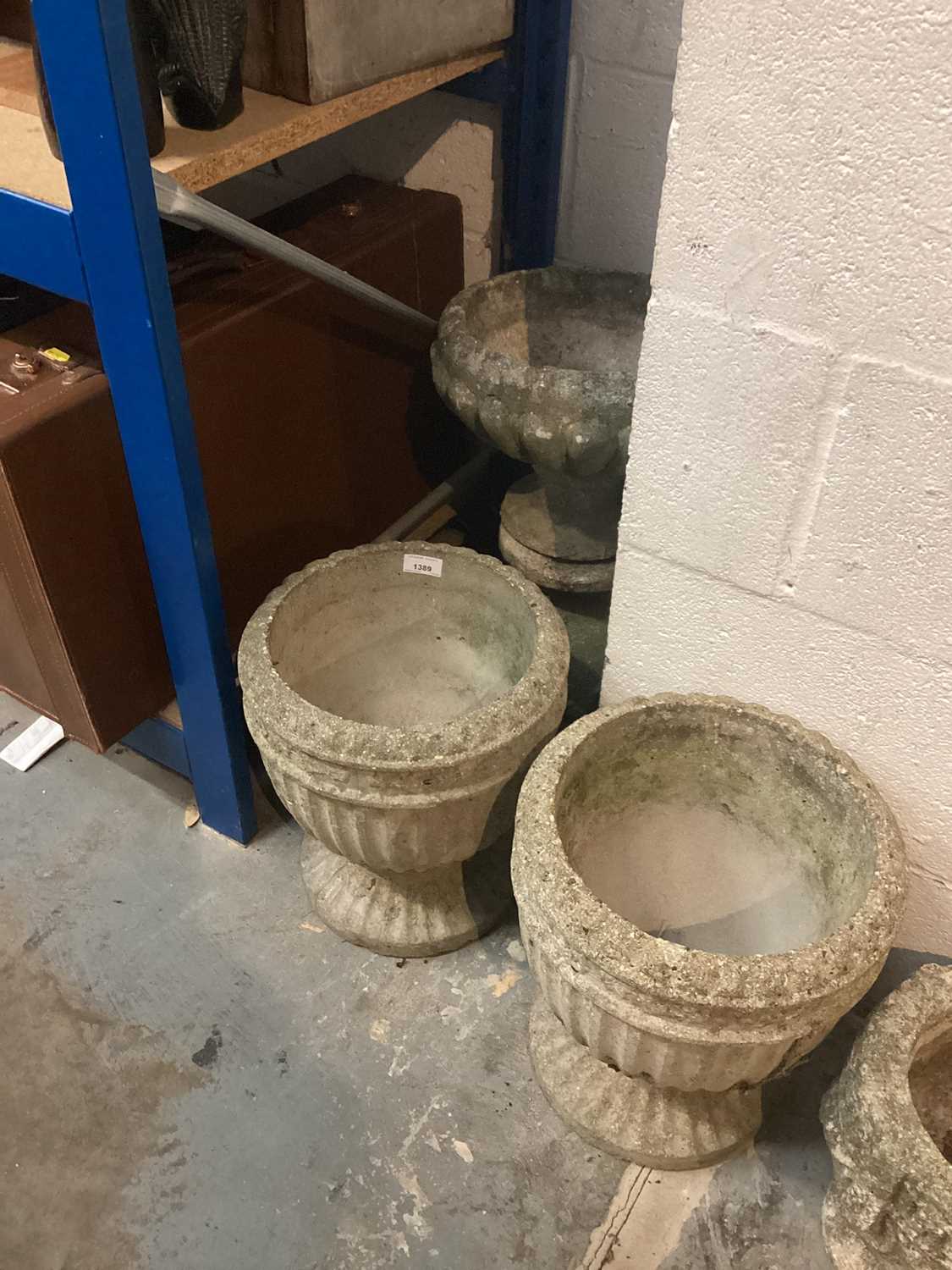 Lot 1389 - Collection of concrete garden urns