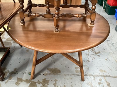 Lot 1209 - Ercol elm oval drop leaf table on square legs joined by x frame stretchers, opening to 112cm x 124cm, together with a set of four matching chairs comprising two elbows and two standards