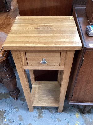 Lot 1210 - Contemporary light oak lamp table with single drawer and under tier, 35cm wide, 30cm deep, 80.5cm high, together with a nest of three hardwood tables