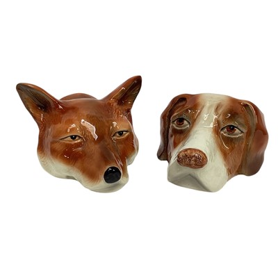 Lot 1227 - Two Victorian-style Staffordshire stirrup cups in the form of a fox and hound