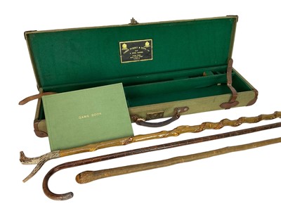 Lot 1238 - James Purdy & Sons leather and canvas gun case, canvas covered game book, antler topped stick and two other sticks (5)