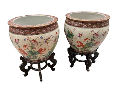 Lot 258 - Pair of large Chinese porcelain goldfish bowls on wooden stands