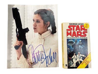 Lot 1437 - Star Wars interest: autographed photo of Carrie Fisher as Princess Leia, and a Star Wars novel with autographs of the actors who played R2-D2 and Chewbacca - all autographs were obtained at a conve...