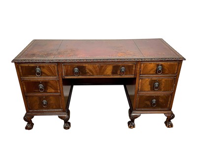 Lot 1582 - Edwardian-style mahogany twin pedestal desk with red leather top and seven drawers