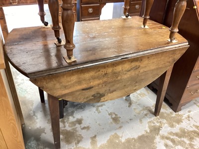 Lot 1268 - Antique elm dropleaf table of good size, with oval leaves standing on square tapering legs