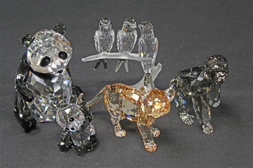 Lot 2191 - Four boxed Swarovski crystal animals - lion...