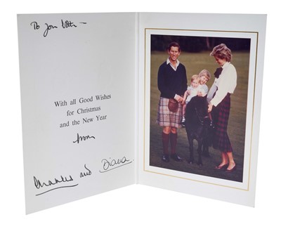 Lot 16 - T.R.H. The Prince and Princess of Wales, signed 1985 Christmas card, with twin gilt ciphers to cover, colour photograph of the happy couple in the Highlands with their young sons on a pony