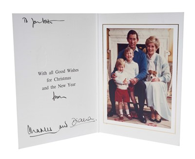 Lot 17 - T.R.H. The Prince and Princess of Wales, signed 1986 Christmas card, with twin gilt ciphers to cover, colour photograph of the happy couple with their young sons and Jack Russel