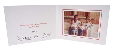 Lot 18 - T.R.H. The Prince and Princess of Wales, signed 1987 Christmas card, with twin gilt ciphers to cover, colour photograph of the happy couple on holiday in Spain with their young sons