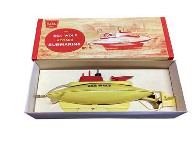 Lot 374 - Sutcliffe metal clockwork models including Jupiter Ocean Pilot Cruiser, Sprite Day Cruiser & The Sea Wolf Atomic Submarine, all boxed (3)