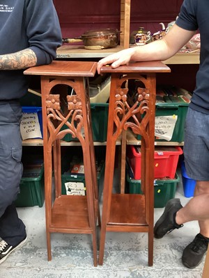 Lot 1238 - Near pair of plant stands with carved decoration, together with another with spiral twist column (3)