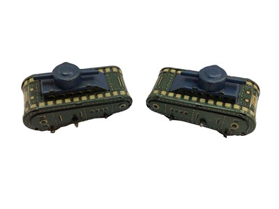 Lot 1830 - Five unboxed tinplate clockwork tanks ,three with camouflage paintwork and two marked German.