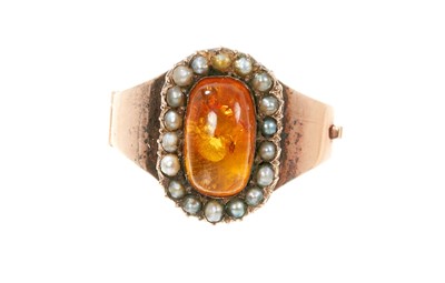 Lot 766 - George III mourning ring with an amber and seed pearl cluster, dated 1801.