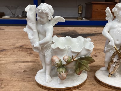 Lot 104 - Two similar late 19th century Moore Bros. porcelain sweetmeat baskets decorated with cherubs and gilt ornament, Greek Key pattern to footrims, stamped and impressed marks, 16.5cm high