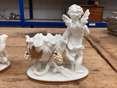 Lot 104 - Two similar late 19th century Moore Bros. porcelain sweetmeat baskets decorated with cherubs and gilt ornament, Greek Key pattern to footrims, stamped and impressed marks, 16.5cm high